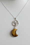 Tiger’s Eye Crescent Moon Necklace with Triskele Symbol – Protection & Strength Crystal Pendant